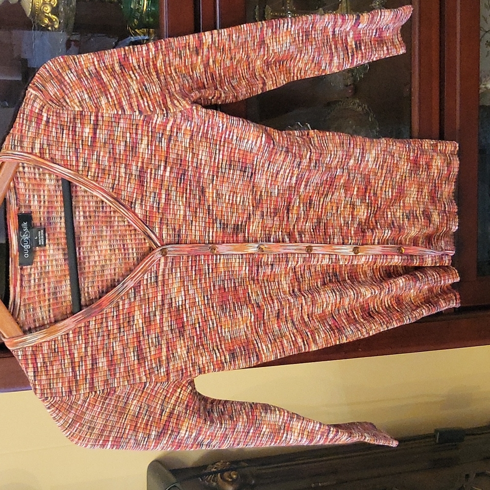Sweater, large decorative buttons, does not open.
